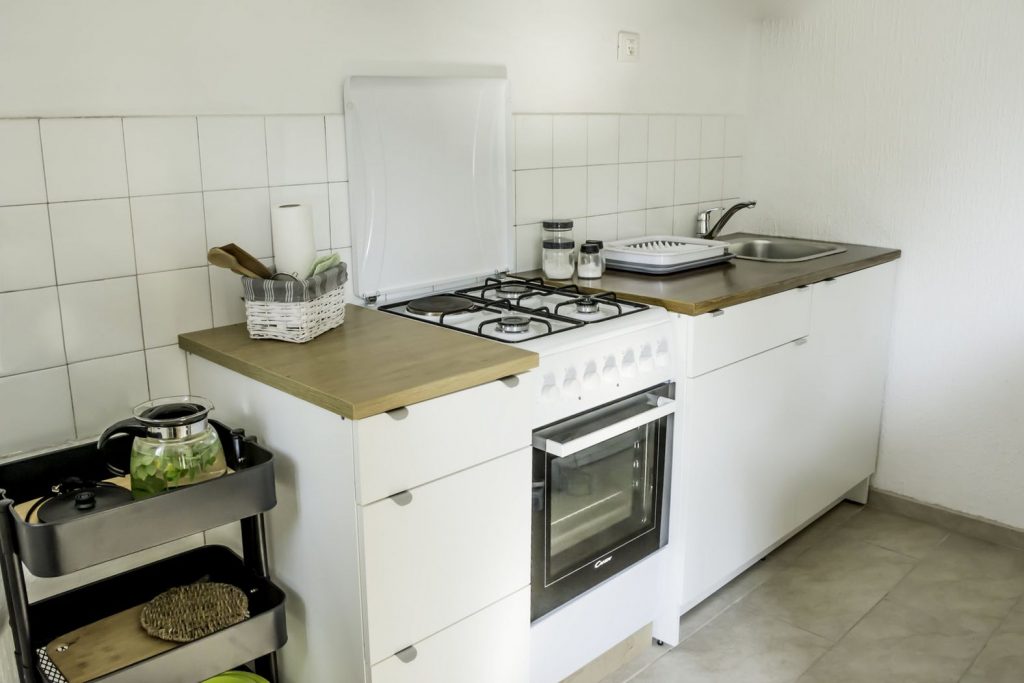 A sparkling clean kitchen ready for use.