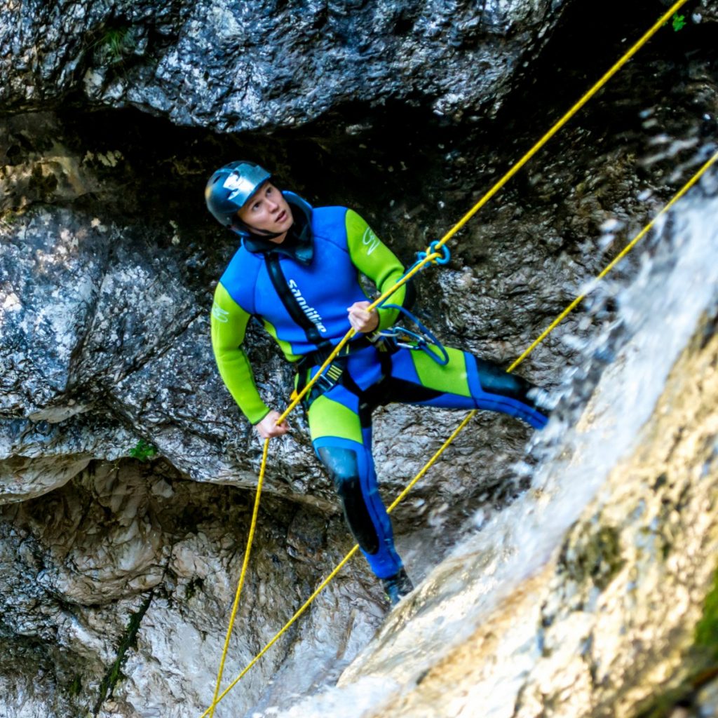A team building participant is rappeling in Fratarica canyon.